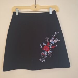 Express Black Skirt with Red and Blue Floral Design